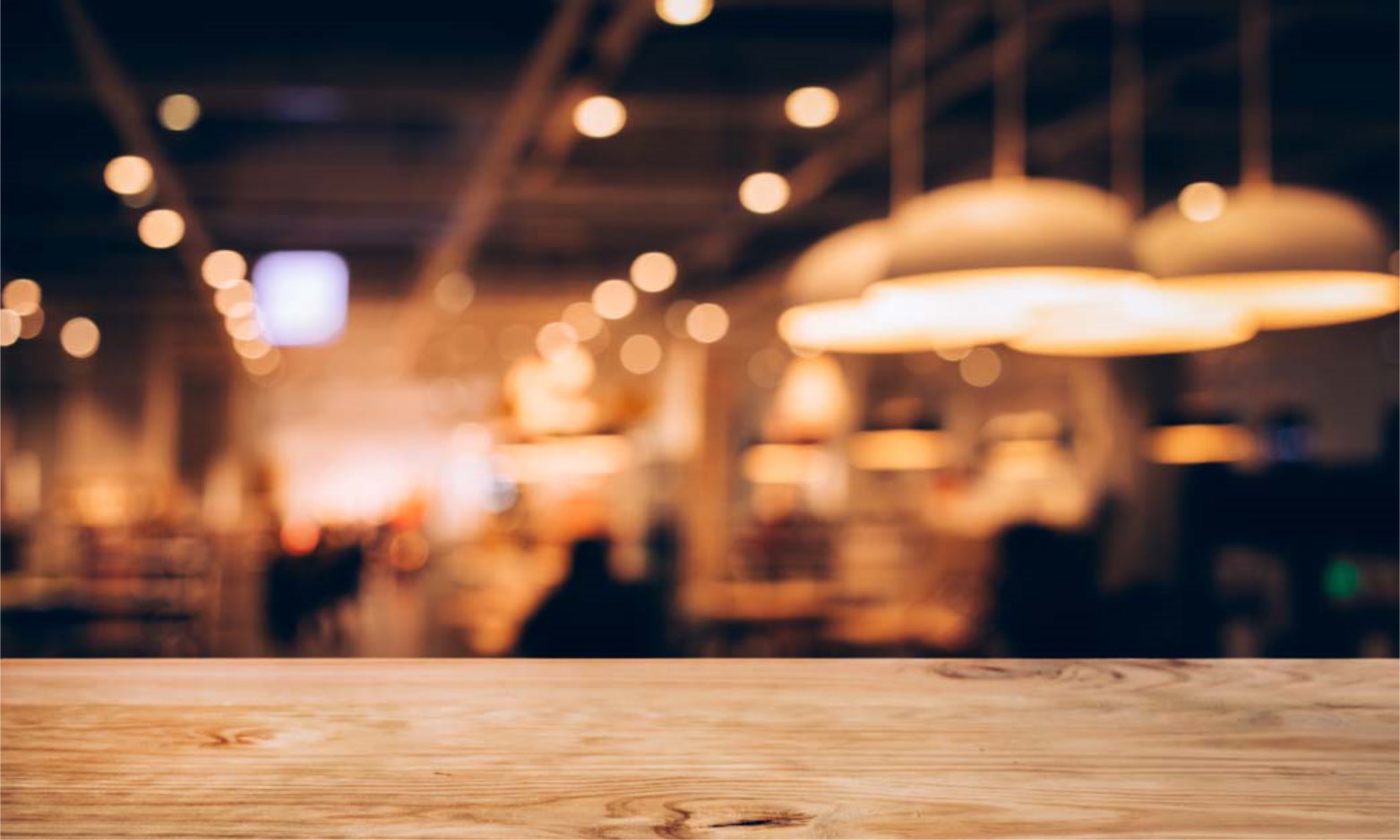 Wood texture table top (counter bar) with blur light gold bokeh